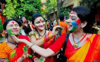 Holi Festival of Colors in India - Girls Playing Colorful Powders