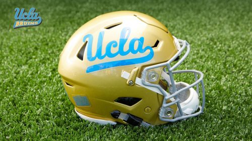 UCLA Football Wallpaper with Picture of Helmet on Grass