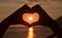 Romantic Wallpaper with Love Symbol in Sunset